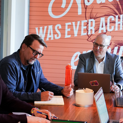 InkFox publicity team working in the boardroom discussing a publishers campaign
