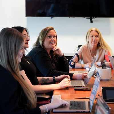 InkFox publicity team working in the boardroom discussing a publishers campaign