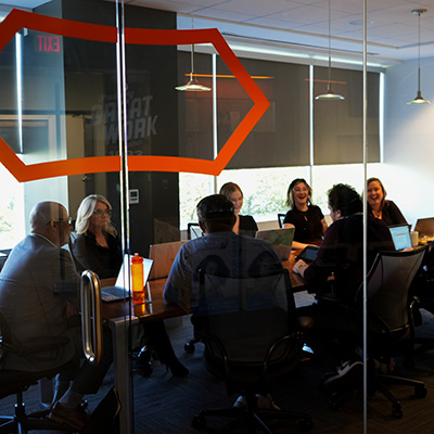 InkFox publicity team working in the boardroom discussing a authors campaign